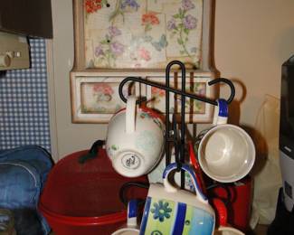 Mugs, on mug tree, with kitchen organizer on the wall