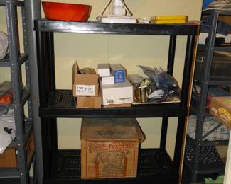 Plastic shelving, with random items on them 