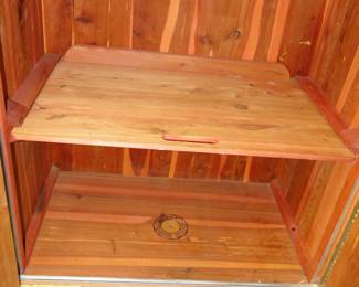 Interior of the MCM Lane storage cabinet.  And no the shelf does not double as a pull out cutting board