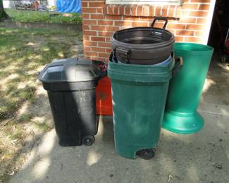 Assorted garbage cans and a leaf bag filler column