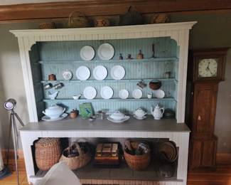 This large display cabinet is for sale. So are the ironstone, baskets, and clock