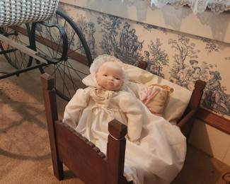 Antique arts and crafts doll bed with hand made bedding and Antique German doll