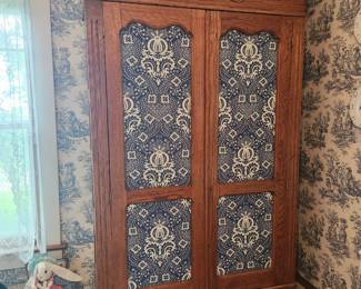 Beautiful wardrobe cabinet with upholstery doors