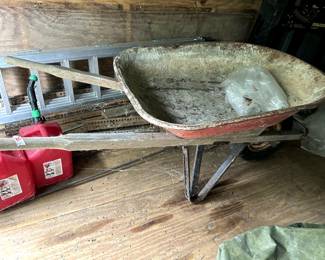 #105	Metal Wheelbarrow w/wood handles  (as is)	 $20.00 
