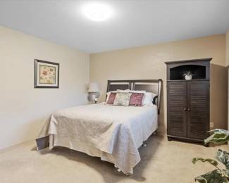  Queen Mattress and Box Springs. Black Secretary Amoire. Lamp.  Black Side Cabinet (not seen). 