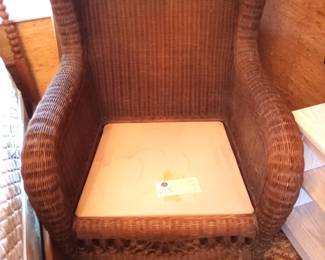 Wicker by Ethan Allen. This is a $350.00 chair easy folks. Talk to me.