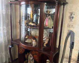 cabinet filled with antiques