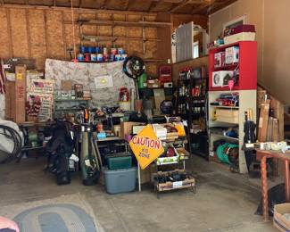 Overview of attached double garage full of a variety of great finds.