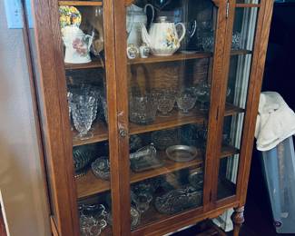 Antique Oak China Hutch filled with treasured tea pots, fostoria, crystal and collectibles.  