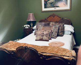 Antique bed.  Absolutely stunning. Vintage telephone.  Several quilts in this home and beautiful bedding. Pink Fostoria tray.  Love.