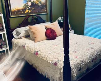 4 poster bed.  Quilts, crochet bed spread (stunning.) Original artwork over bed.  