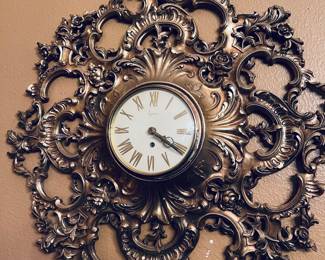 Lovely ornate clock by Syroco.  19". Vintage mid-century.