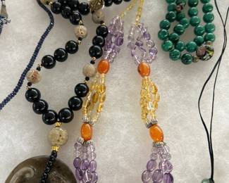 Left to right… Carved jade dragon pendant ,Multicolor, Amber, amethyst necklace,