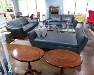 Natuzzi Editions "like new" pair of leather sofas and chaise, area rug, pair of chrome & glass coffee tables, side tables