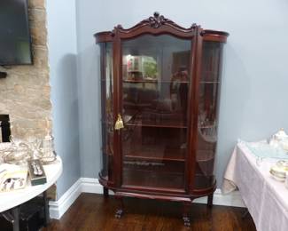Antique curved glass curio cabinet