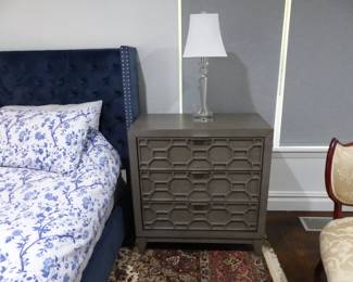 King size rich blue upholstered bed with nail head trim, pair of night tables & lamps, area rug