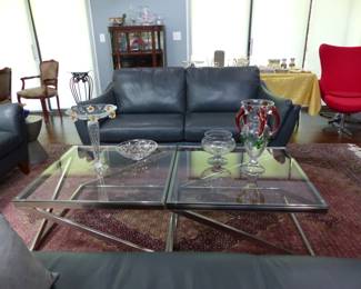 Natuzzi Editions "like new" pair of leather sofas and chaise, area rug, pair of chrome & glass coffee tables