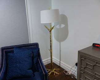 Single blue chair with nail head trim, gold branch floor lamp