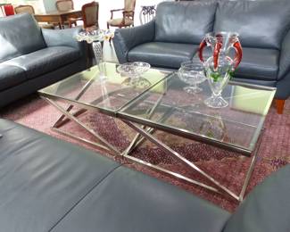 Natuzzi Editions "like new" pair of leather sofas and chaise, area rug, pair of chrome & glass coffee tables, bric-a-brac