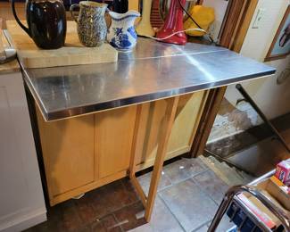 Breakfast bar/stainless counter top cabinet on wheels.