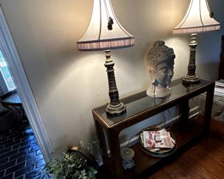 console table, pair of lamps, carved Asian head
