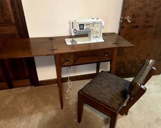 Singer sewing machine with cabinet & chair