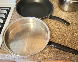 Teflon skillet was $12, NOW $9 Stainless skillet,  was $12, NOW $9