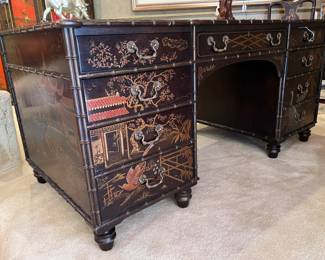 Vintage Henredon ‘Folio 10’ Double Pedestal Chinoiserie Desk with rectangular Top inset with Three (3) Gilt Tooled Leather writing surfaces- sits above Two (2) sets of Four (4) graduated Drawers flanking a Center Drawer, Trimmed with Faux Bamboo and had surfaces painted with Asian inspired Landscapes including Pagodas, Willow Trees and Cranes accompanied with matching Armchair..