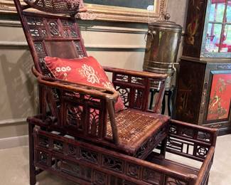 A Vintage Chinese Export Bamboo Chaise/Day Bed- adjustable Back Rest sits above a Caned Rectangular Seat flanked by Armrests.. the Base incorporates a pull out Foot Rest..