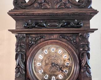 A Gazo Family ’The Californian’ 8ft tall ‘Open Well’ Case Clock Featuring Carved Oak Draped Figures with Etched Solid Brass Dial with Porcelain Numerals-(96”x27”x17”)..