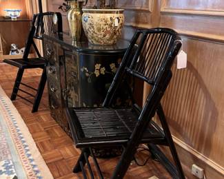 Vintage Chinese Black Lacquer Elmwood ChinoiserieStyle Bar/Cabinet with Painted Scenes and Figures. Pair of Bamboo Black Lacquard folding chairs. 