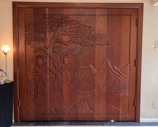 A set of Gorgeous Mid Century Carved Wooden Asian Bi-Fold Doors and Frame with Tree, Mountain and Asian Figures..