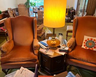 Orange wing back chairs 
Side tables
Lamps 