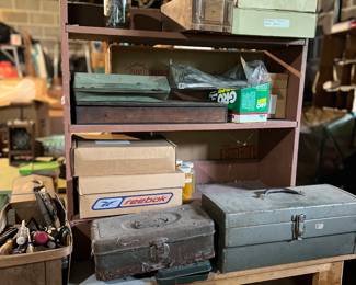 Lots of tool boxes and tools 