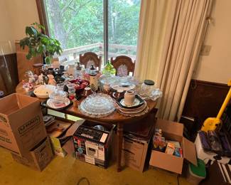 Table and chairs 
Lots of collectibles. 