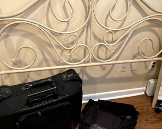 Wrought iron head board and   suitcases 