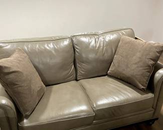 Grey leather love  seat 