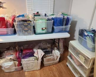 Quilter paradise! Two rooms of fabric in packages sold by weight, started projects, cut fabric, supplies, notions, quilting books.