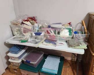 Quilter paradise! Two rooms of fabric in packages sold by weight, started projects, cut fabric, supplies, notions, quilting books.