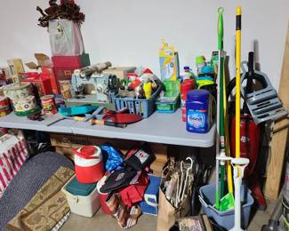 small coolers, household cleaning supplies and new in package cleaners.