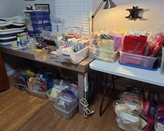 Quilter paradise! Two rooms of fabric in packages sold by weight, started projects, cut fabric, supplies, notions, quilting books.