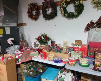 Christmas decor, bundles of wrapping, bows, boxes, some items crafted by quilter.