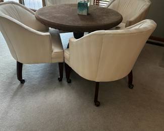 Wood pedestal table with 4 chairs.  Top has been protected and is in excellent condition.
