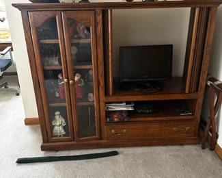 Nice media center.  Doors cover large opening.