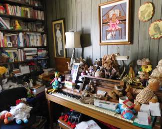 Upright piano, books, plush artwork all in one throwback turntable