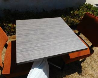 side table with modern chairs