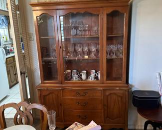 China hutch with glassware. 