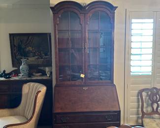 Two piece glass door cabinet with secretary. 