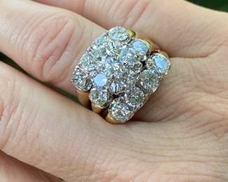 #150 - 14kt yellow gold fifteen stone,cast made ring, with 24kt white gold top. fourteen, round, full cut diamonds 0.25ct each. (SI 1- F-H range) & one round brilliant cut diamond of about .51 ct (SI-2 - F-H range). Size 10- Appraisal & price available upon request.