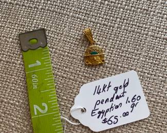 #136 B - $65 - 14kt gold pendant Egyptian 1.60 grams